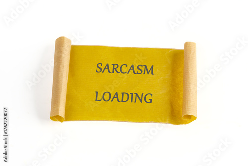 Fotografia A cheerful scroll with the phrase sarcasm loading written in bold letters brings a lighthearted touch to the room