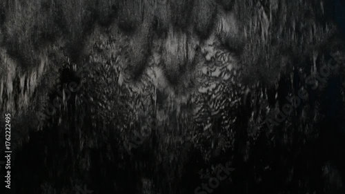 Black water wall, dark water feature, black fountain wall.