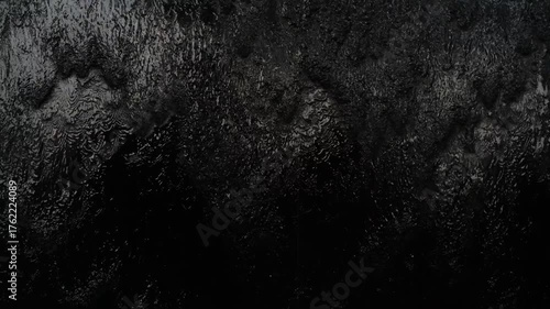 Black water wall, dark water feature, black fountain wall.