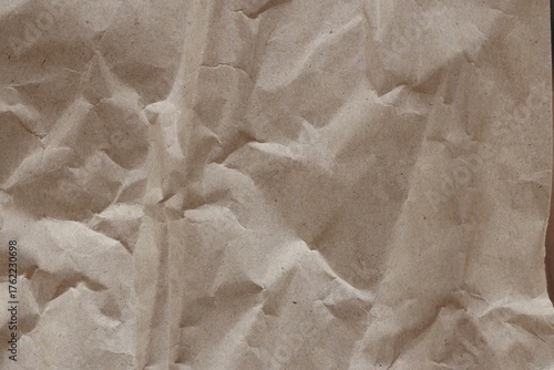 Brown crumpled recycled paper texture background. Kraft Paper