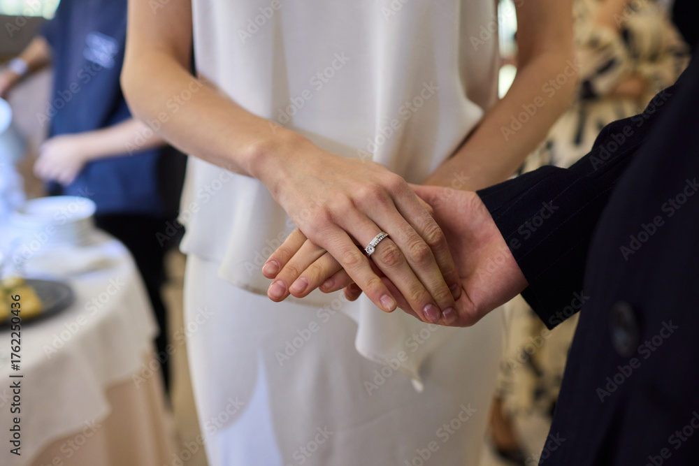 Fototapeta premium An Elegant Wedding Ceremony Featuring the Graceful Hands of Couples in Love and Joyous Unity