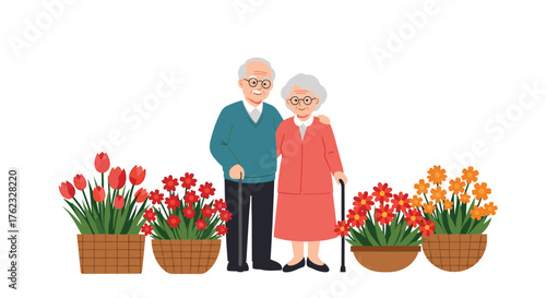 Elderly couple standing by flowers in a garden.