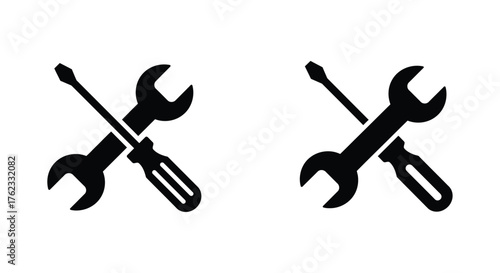 Two crossed tool icons a screwdriver wrench and a wrench screwdriver