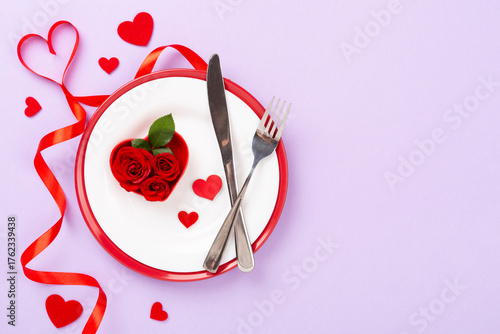 Festive table setting for Valentine's Day on color background, top view