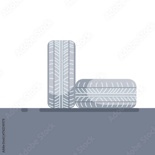 Winter tires on asphalt in minimalist style with grey colors  
