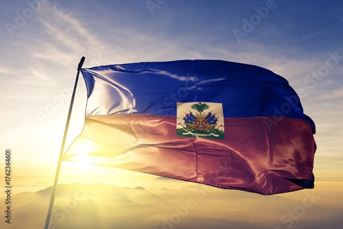 Haiti haitian flag waving on the top sunrise mist fog