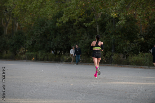 Wallpaper Mural Back view of a jogger woman running Torontodigital.ca