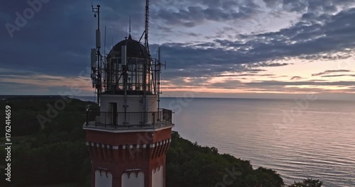 Beautiful lighthouse at sunset in Rewal at Baltic Sea.