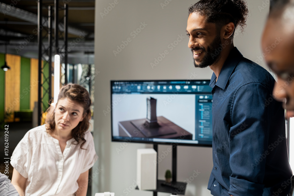 Fototapeta premium Property development team evaluating 3D models structural layout for a housing project focused on sustainability and urban infrastructure growth. Modern briefing meeting for site construction.