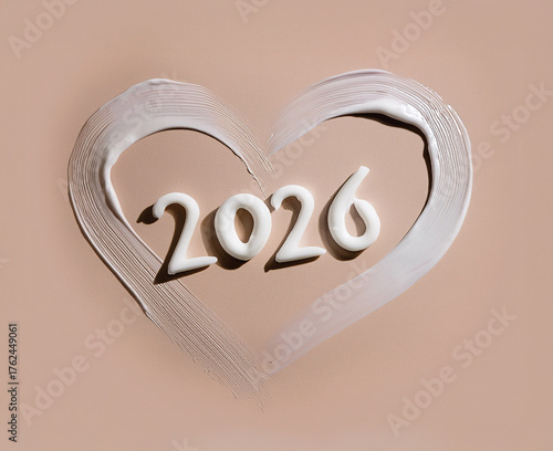 Writing 2026 with Cream on skin. 2026 White Cream Design on Nude Skin Tone Surface – Elegant Beauty and Skincare Concept. 2026