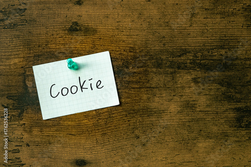 There is a piece of paper with the word Cookie. It is as an eye-catching image.