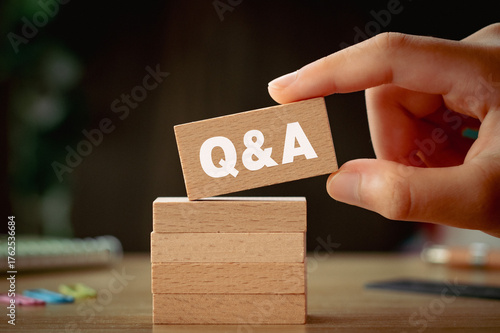 There is wood block with the word Q&A. It is as an eye-catching image.
