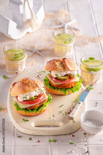 Tasty fish burger served wi...