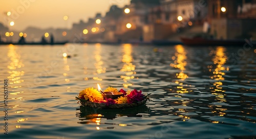 Floating Diya and Flowers on Ganges River at Dusk.