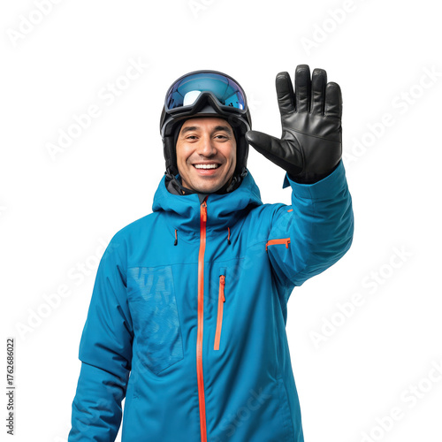 Happy young adult man wearing a blue ski jacket, helmet, and goggles, smiling and waving his hand, ready for winter sports on a transparent background