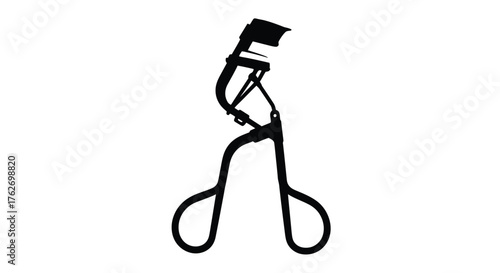 A black and white image of an eyelash curler stark silhouette