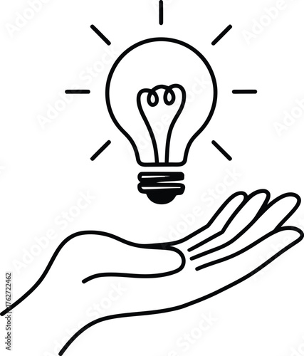 Hand holding glowing light bulb with radiating lines