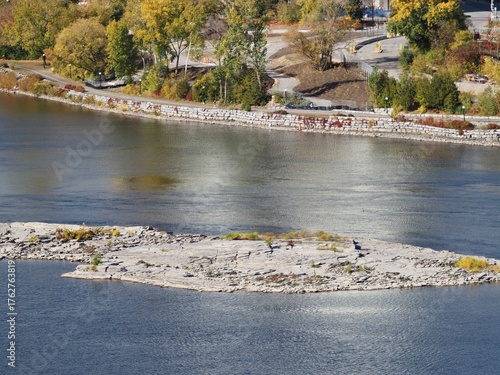 Rocky Riverbank and Autumn Reflections in Ottawa, Canada
