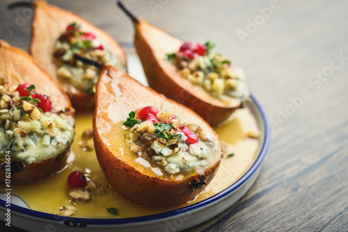 Delicious baked pears with nuts, blue cheese, thyme, cranberry and honey
