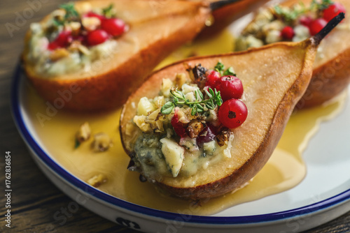 Delicious baked pears with nuts, blue cheese, thyme, cranberry and honey