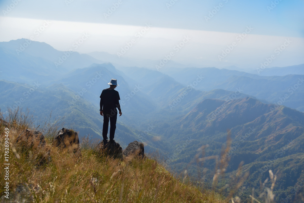 Obraz premium Man travel hiker adventure on mountain nature landscape. Asia people lifestyle tourist and camping outdoors for relax summer time