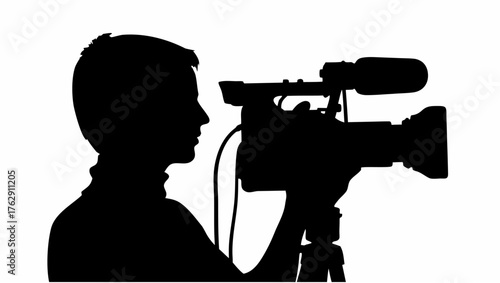 Silhouette of a person holding a professional video camera with microphone and tripod in a studio setting
