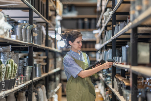 A Female Entrepreneur in a Family Run Ceramic Business Checking Stock