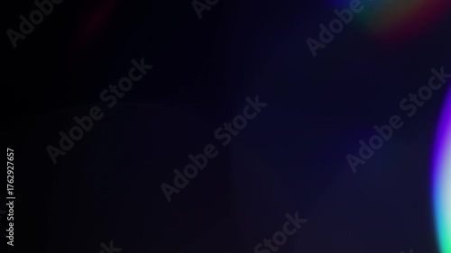 Multicolored light leaks footage on black background, lens flare leak burst overlays transitions new organic