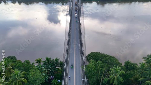 Tilt up view of the Macapagal Bridge crossing the Agusan River in Butuan Philippines. 