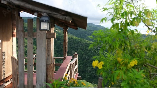A wooden house in the forest and mountains