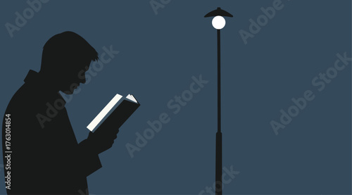 Silhouette of Man Reading Under Street Light