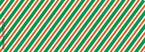 Striped candy cane Christmas seamless pattern. Red and green diagonal lines wallpaper. Winter holiday present wrapping paper. Vector gift decor backdrop. Xmas peppermint repeating background.Eps10