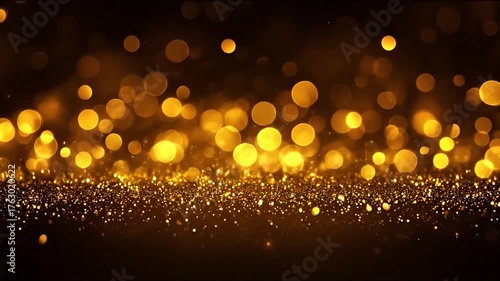 Golden sparkling bokeh lights and glitter particles on a dark abstract background, perfect for festive celebrations and luxury designs