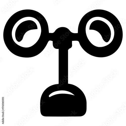 A black and white image of a weather vane with two large round eyes