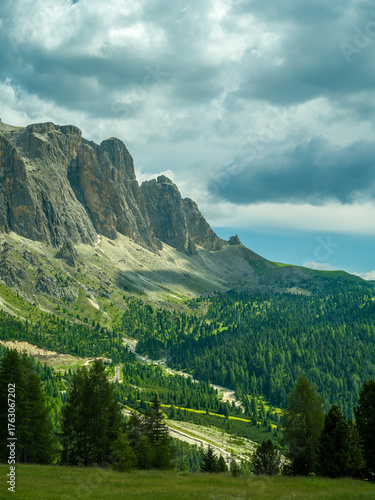 Spectacular view of Seceda ridgeline in the Dolomites, Italy. Dramatic limestone peaks rising above vibrant green slopes under a bright summer sky — a breathtaking natural masterpiece.