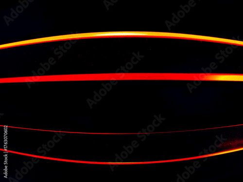 Abstract black background illustration with glowing lines and a dynamic wave motion design.