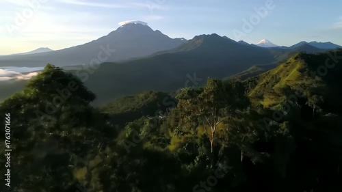 Aerial View of Volcanic Mountains Covered in Green Forests During Daylight