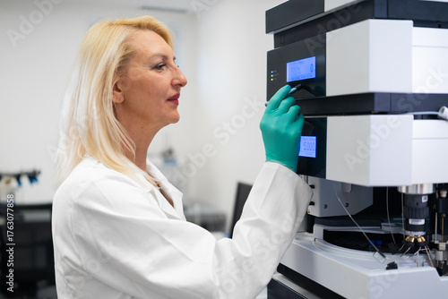 Wallpaper Mural Professional technician performing maintenance and calibration of HPLC system for reliable laboratory results. Torontodigital.ca