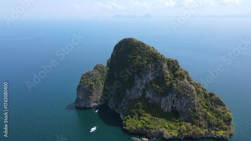 Aerial footage of Koh Waen or Waen Island, a small island in Andaman sea famous for scuba diving with unique artificial reef and vibrant coral reef located in Trang Province, Thailand.