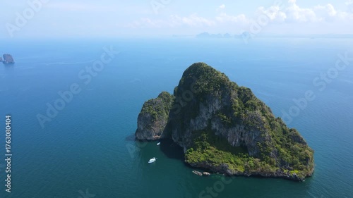 Aerial footage of Koh Waen or Waen Island, a small island in Andaman sea famous for scuba diving with unique artificial reef and vibrant coral reef located in Trang Province, Thailand.