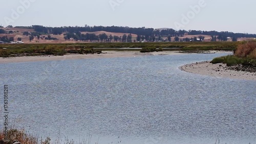 Bend In Petaluma River With Ripples On The Water And Hills In Background
