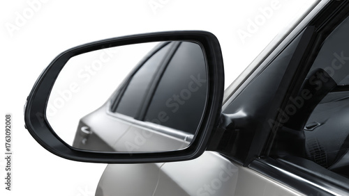 A car's side view mirror reflecting tinted windows and car interior isolate
