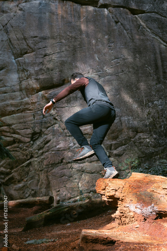 Man leaping from a cedar tree