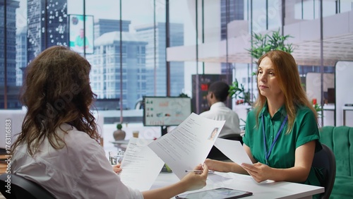 Quadro em tela Human resources staff evaluating candidates resume in the selection process, reviewing all applicants after job interview in order to hire the right person