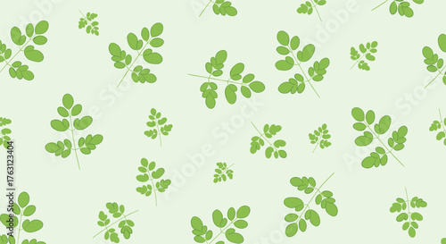 A pattern of green moringa leaves scattered on a light green background in a seamless repetition