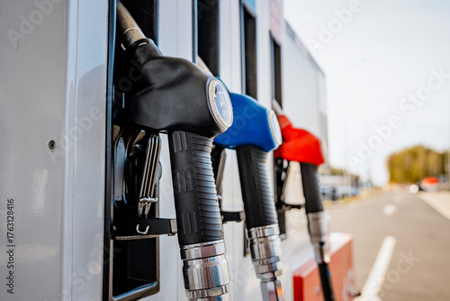 Photography Diesel petrol fuel pistols nozzle refill at gas station