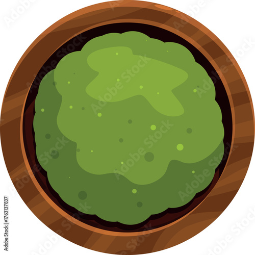 Freshly prepared wasabi paste sits in a wooden bowl, ready to add a pungent kick to any dish