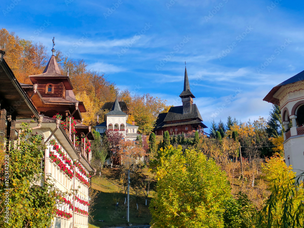 Obraz premium Wooden church from Rohia Monastery, in Maramures county, now a museum of icons and old books (Biserica de lemn de la Mănăstirea Rohia, Maramureș, România, acum muzeu de icoane și carte veche)
