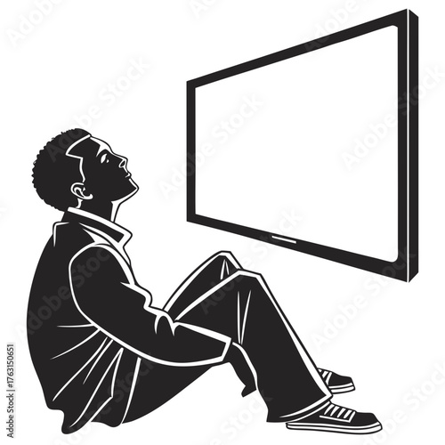 Silhouette of a man sitting and looking at a blank tv screen