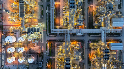 Aerial view Oil and Gas refinery plant at night, Global business energy logistic transportation, Oil and gas refinery petrochemical industrial, Petrochemical refinery industrial energy supply chain.